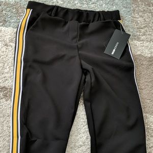 Black pants with yellow and white stripe on sides